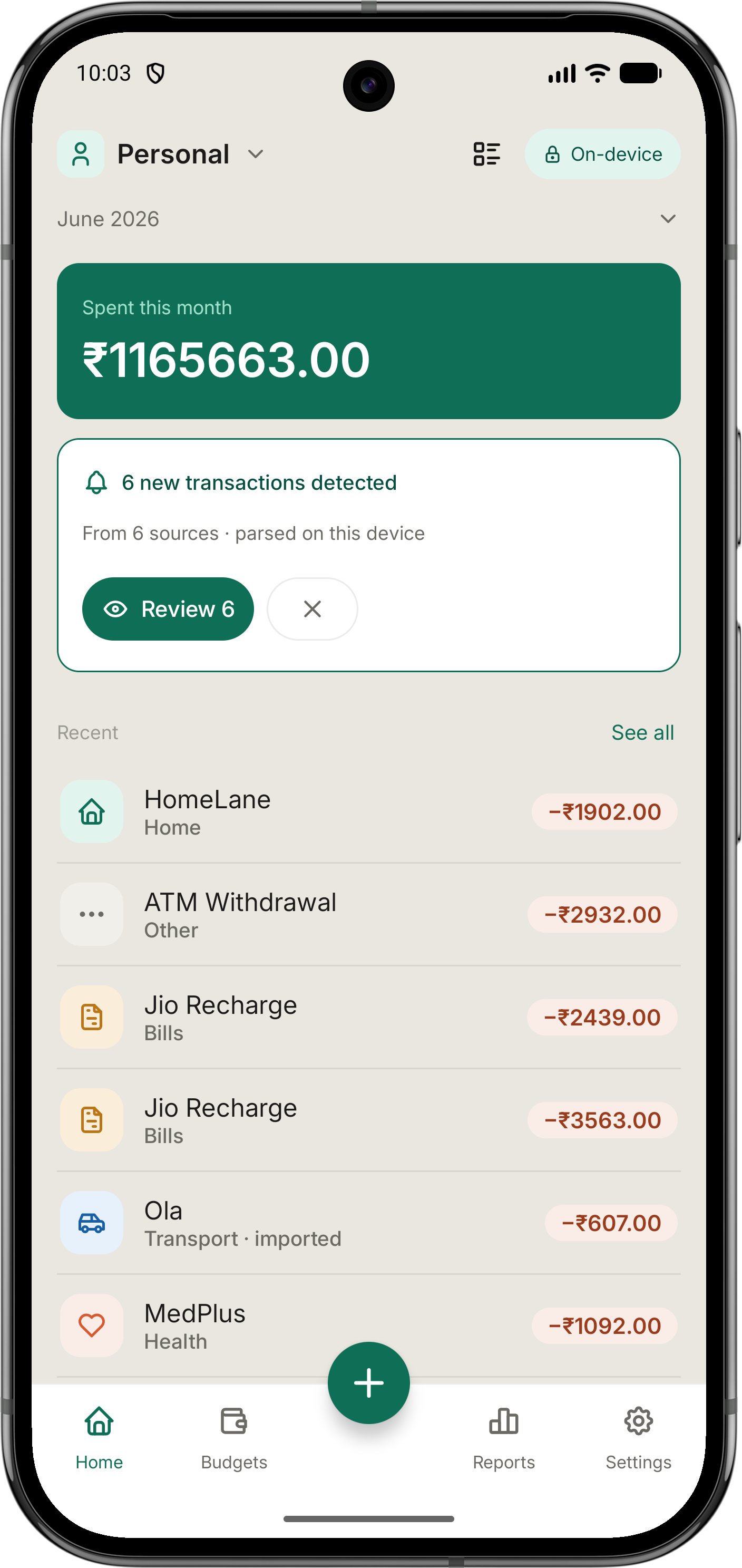 Tindra home screen showing this month's spending and auto-detected transactions